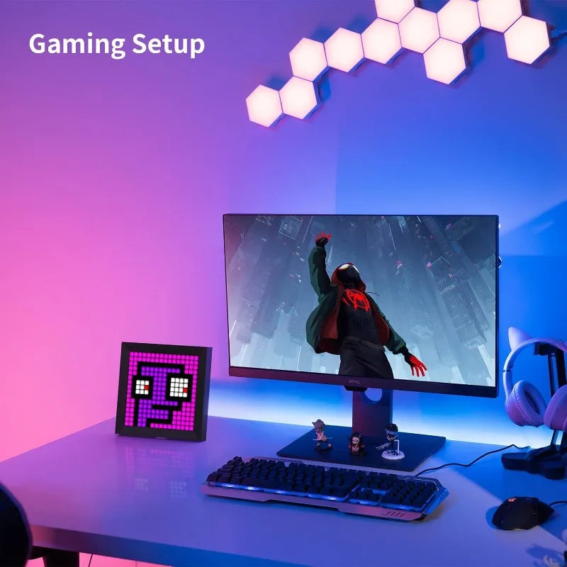 Gaming setup with monitor, keyboard, and mouse on a desk with colorful lighting.