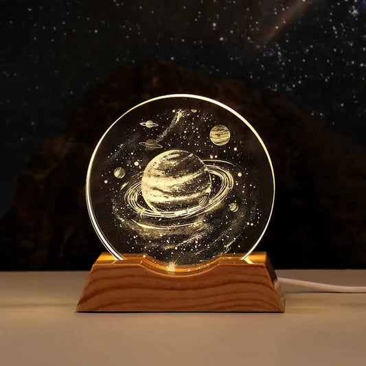 Decorative lamp with celestial design on a wooden base against a dark background