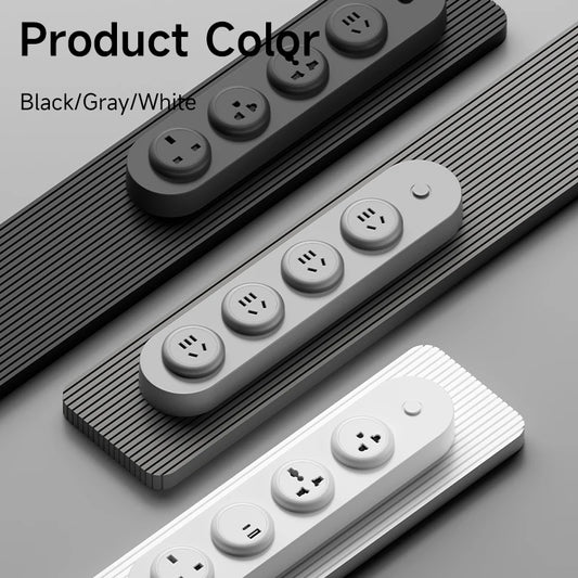 Three power strips in black, gray, and white on a gray background