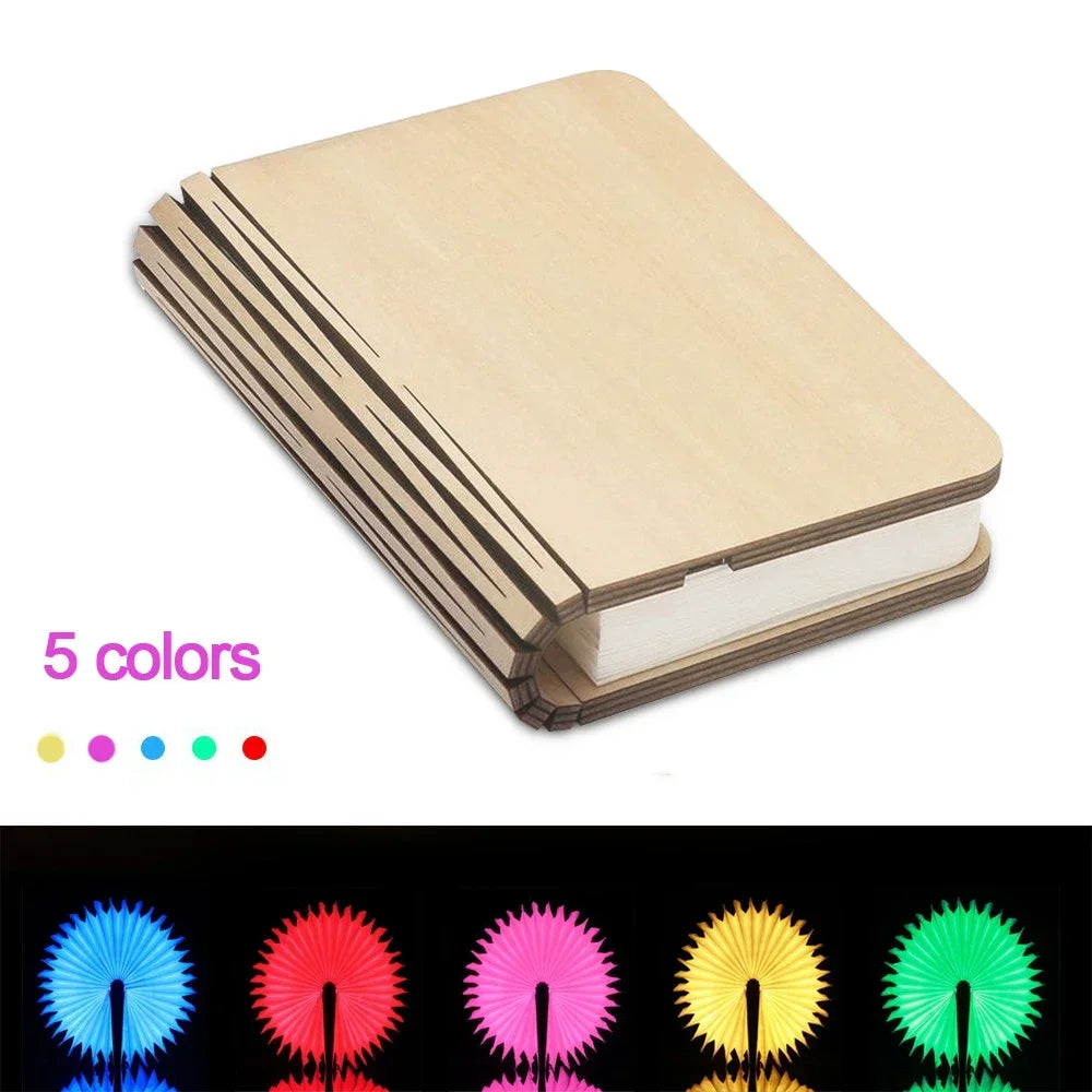 Folding wooden book with colorful glowing ends on a white background